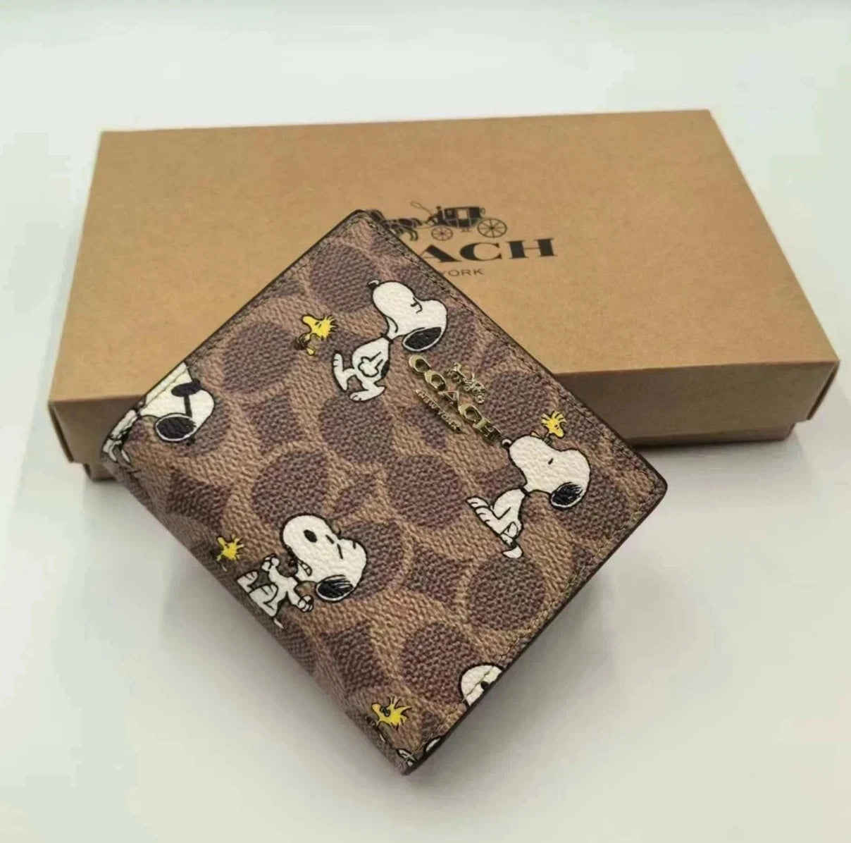 Coach X Peanuts Snap Wallet In Signature Canvas With Snoopy Print CBN32