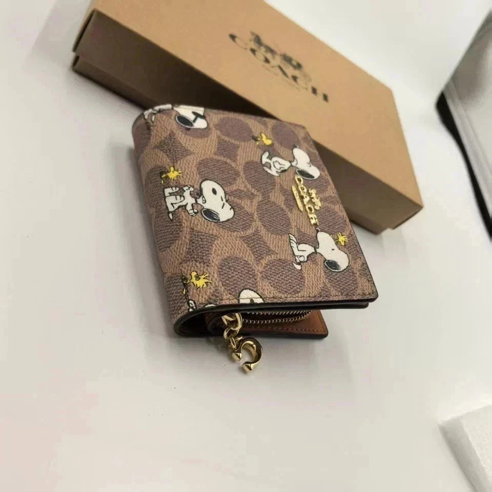 Coach X Peanuts Snap Wallet In Signature Canvas With Snoopy Print CBN32